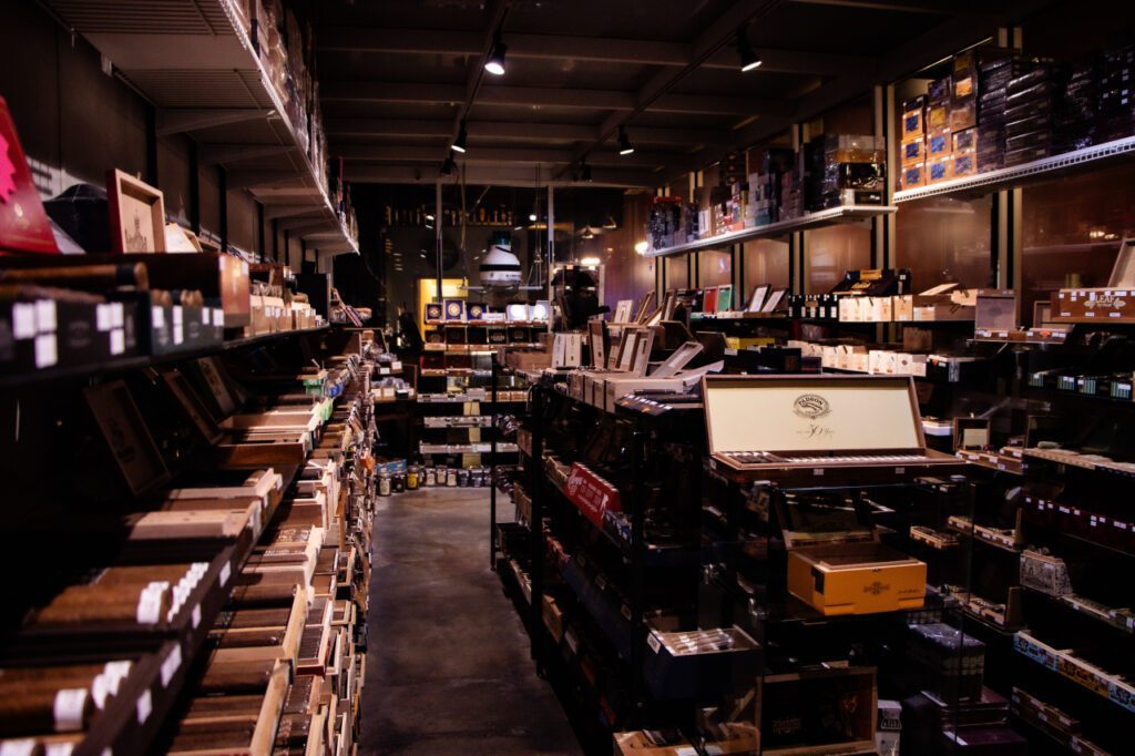 Aisle inside the Classic Cigars humidor lined with shelves of cigar boxes